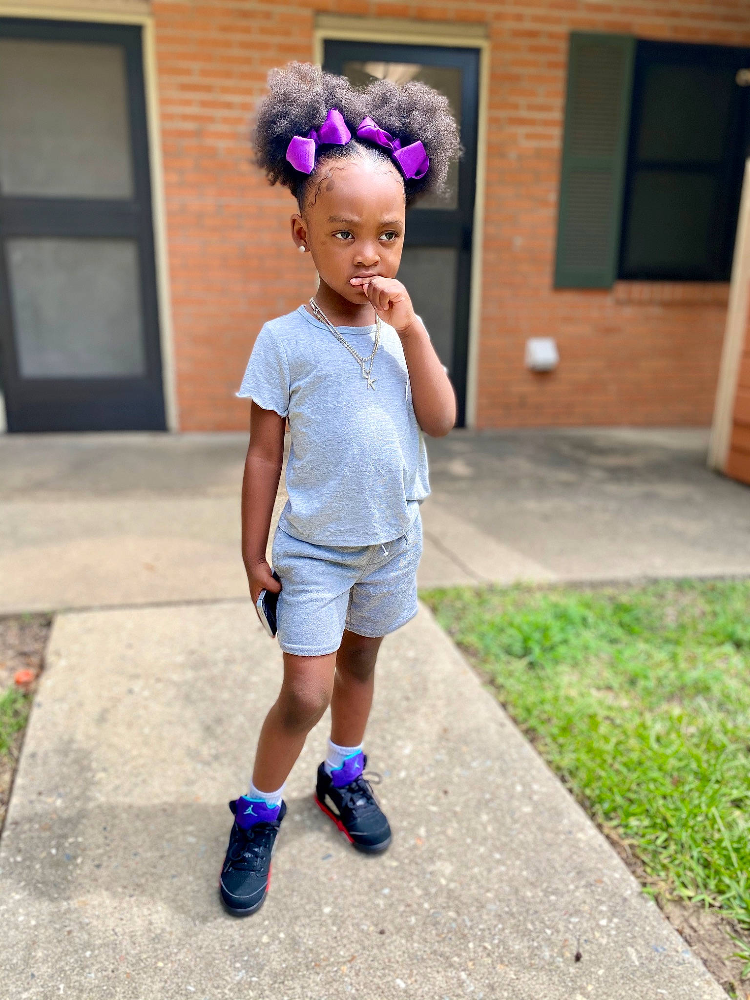 Londyn joined the competition — help win amazing prizes! asphalt, child, door, electric_blue, fun, grass, hair, happy, head, human_leg, leisure, magenta, person, pink, plant, shorts, sportswear, standing, t_shirt, toddler