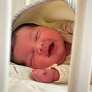 Kenzy a rejoint le concours — aidez-le/la à gagner de superbes lots ! baby, newborn, sleeping, crib, blanket, infant, fist, cozy, soft, cute, child, peaceful, face, indoors, closeup, skin, clothing, rest, quiet, toddler