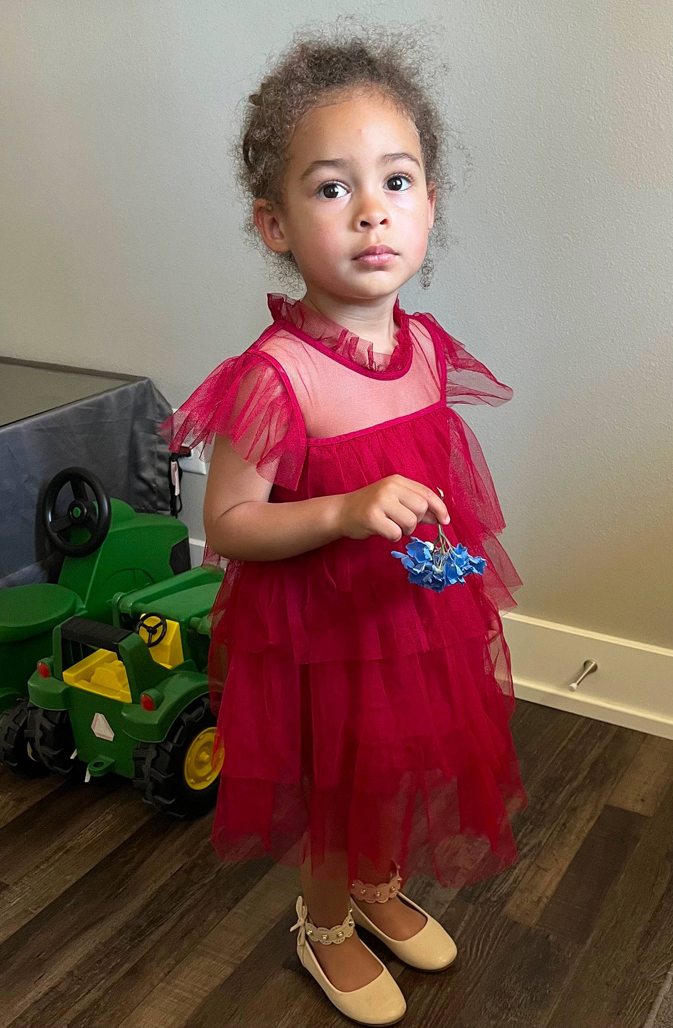 Rayne joined the competition — help win amazing prizes! baby_toddler_clothing, child, day_dress, dress, eye, face, fashion_design, flooring, happy, hardwood, head, magenta, one_piece_garment, person, pink, sleeve, tire, toddler, toy, wheel