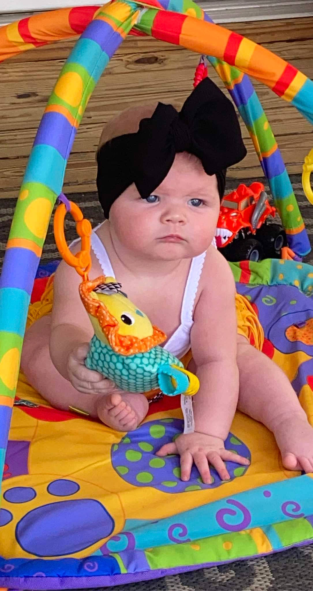 Nattalie is registered to the contest to win money with this photo: arm, baby, baby_toddler_clothing, child, face, facial_expression, fun, hairstyle, happy, head, leisure, orange, person, photograph, pink, product, skin, summer, textile, toddler