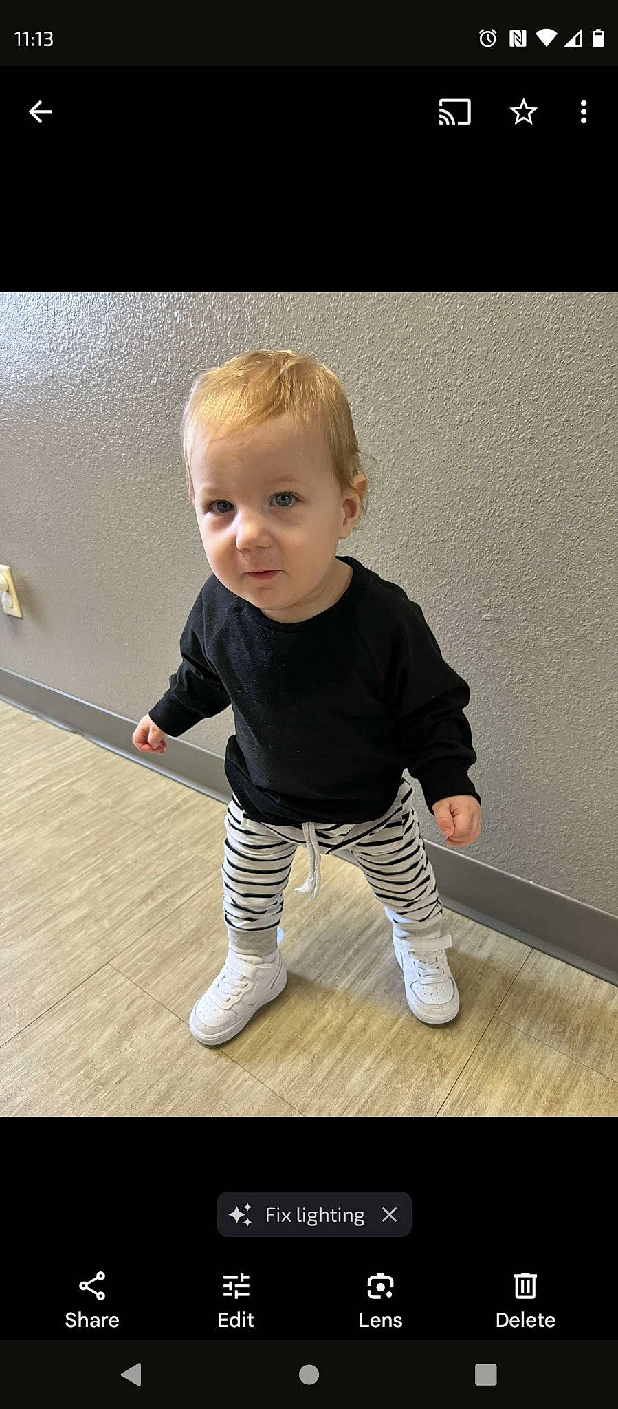 Dezmond is registered to the contest to win money with this photo: arm, baby, baby_toddler_clothing, cheek, eye, floor, flooring, hair, happy, hardwood, human_body, joint, leg, person, product, skin, sleeve, standing, t_shirt, toddler