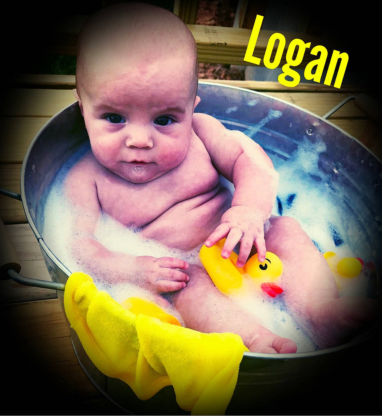 Logan joined the competition — help win amazing prizes! baby, baby_bathing, bathing, bathtub, cheek, child, eye, face, fun, head, nose, person, play, product, rubber_ducky, skin, smile, toddler, toy, tummy_time