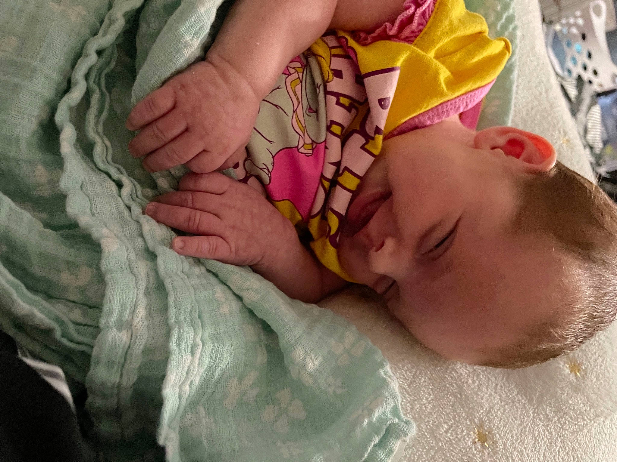 Arielle is registered to the contest to win money with this photo: abdomen, baby, baby_products, baby_sleeping, baby_toddler_clothing, bedtime, child, comfort, finger, gesture, hand, happy, human_leg, linens, mouth, nail, pattern, person, skin, thigh