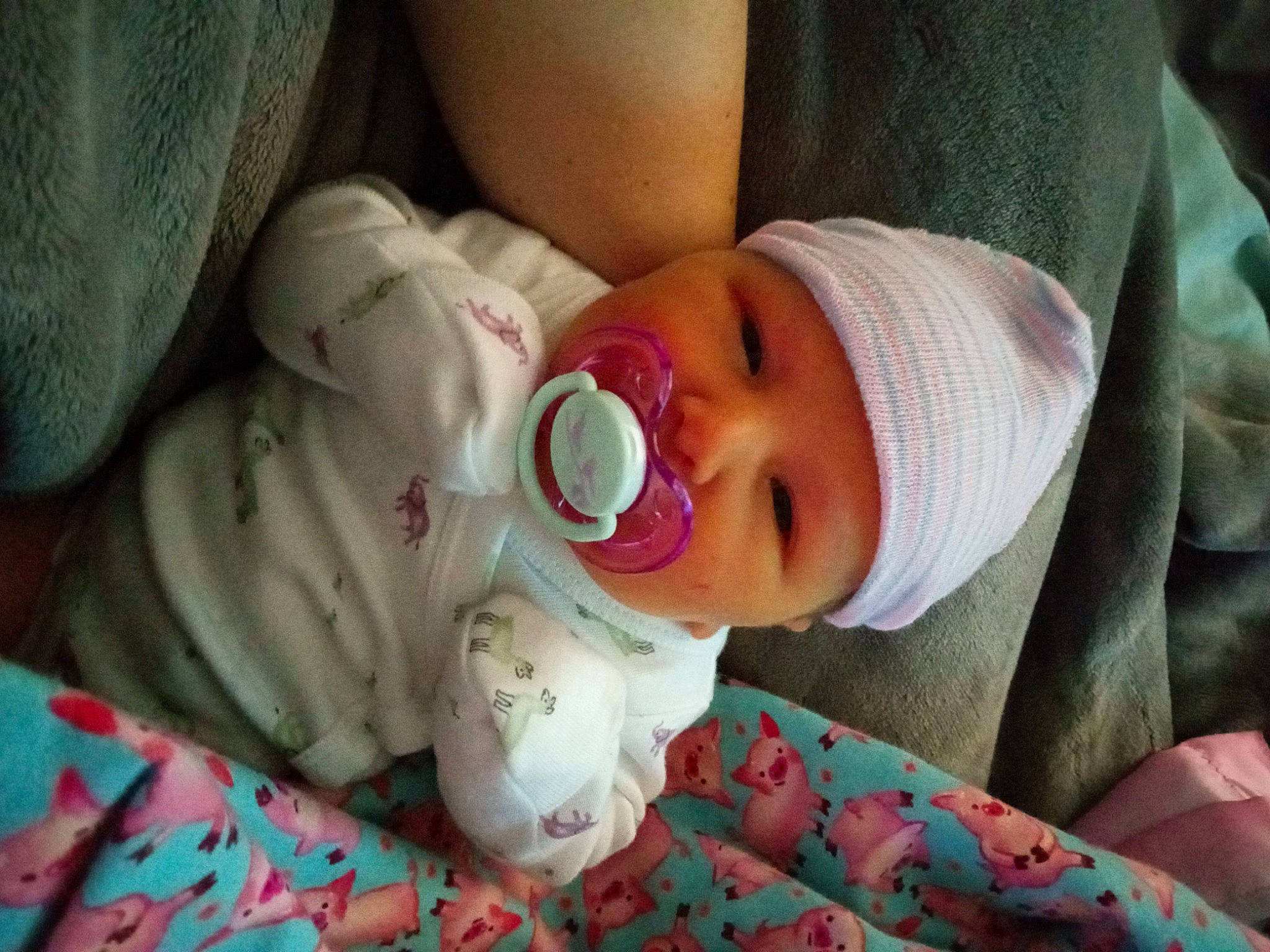 Ruby is registered to the contest to win money with this photo: baby, baby_products, baby_toddler_clothing, carmine, cheek, child, comfort, eye, face, hat, head, headgear, headwear, linens, lip, mouth, nose, person, product, skin