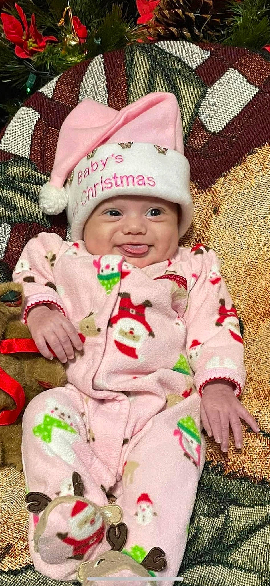 Sofia is registered to the contest to win money with this photo: baby, baby_toddler_clothing, cap, carmine, child, event, eye, face, grass, happy, head, headwear, joy, knit_cap, leaf, pattern, person, pink, sitting, skin