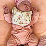 baby, newborn, sleeping, pink_clothing, hat, bib, blanket, soft_texture, infant, cute, peaceful, cozy, footwear, ribbons, portrait, resting, small_hands, toddler, indoor, child