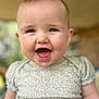 baby, child, smiling, face, portrait, cute, infant, happy, clothing, green, pattern, short_sleeves, skin, head, eyes, mouth, tongue, indoors, blurred_background, person