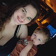 Jameson joined the competition — help win amazing prizes! woman, child, toddler, smile, curly_hair, blue_eyes, indoor, casual_clothing, portrait, family, person, happy, closeup, light, shadow, background, room, baby, young_child, skin