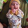 Hennessi is registered to the contest to win money with this photo: baby, smiling, infant, onesie, hat, winnie_the_pooh, clothing, hands, blanket, plush_toy, happy, cute, child, portrait, lying_down, indoors, person, face, young_child, cozy