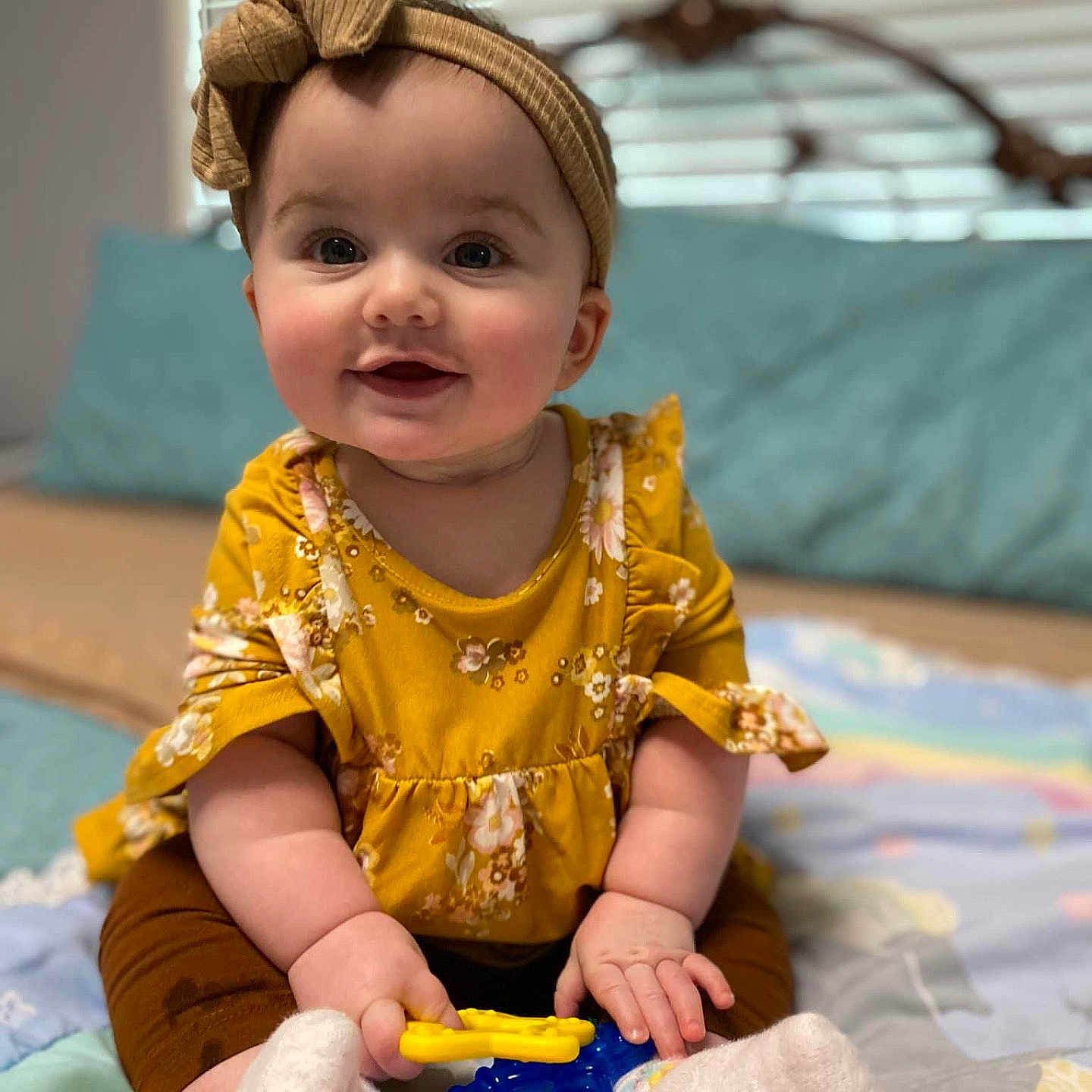 Emmeryn joined the competition — help win amazing prizes! accessories, baby, babylaughing, clothing, crawling, face, furniture, happy, head, headband, hosiery, person, photography, portrait, quilt, sitting, sleeve, smile, sock, toy