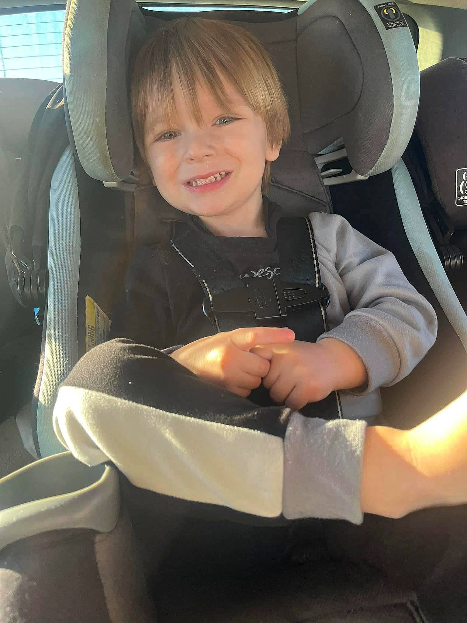 Levin is registered to the contest to win money with this photo: auto_part, automotive_design, automotive_exterior, car, car_seat, car_seat_cover, comfort, family_car, head_restraint, joy, luxury_vehicle, motor_vehicle, person, personal_luxury_car, seat_belt, smile, steering_part, steering_wheel, toddler, vehicle