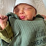 baby, newborn, sleeping, face, hat, blanket, green_blanket, pout, cute, infant, child, peaceful, soft, swaddled, clothing, hand, portrait, indoors, headwear, resting
