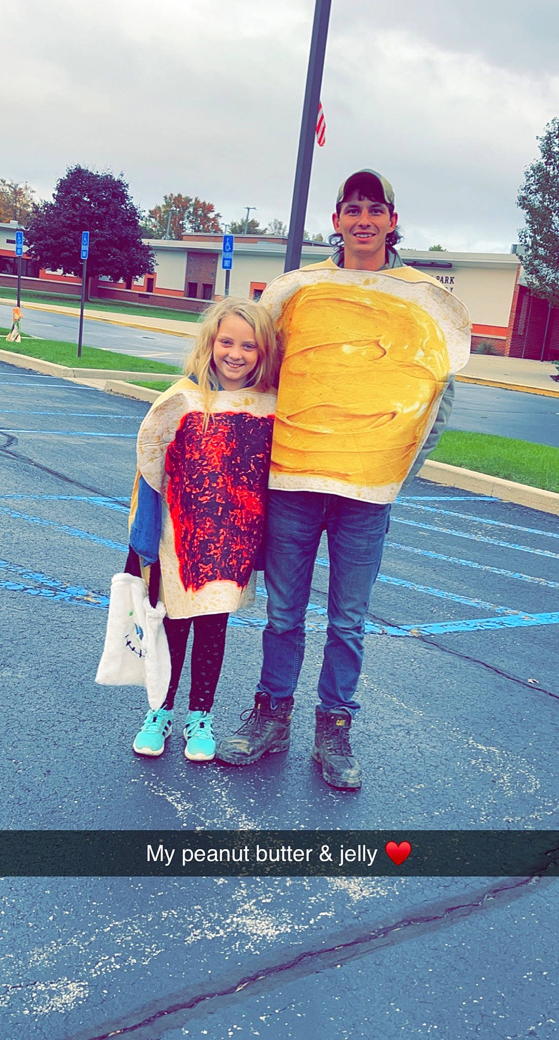 Layla joined the competition — help win amazing prizes! asphalt, blue, cool, denim, electric_blue, event, flag, fun, gesture, happy, joy, leisure, magenta, person, plant, pole, recreation, sky, smile, standing