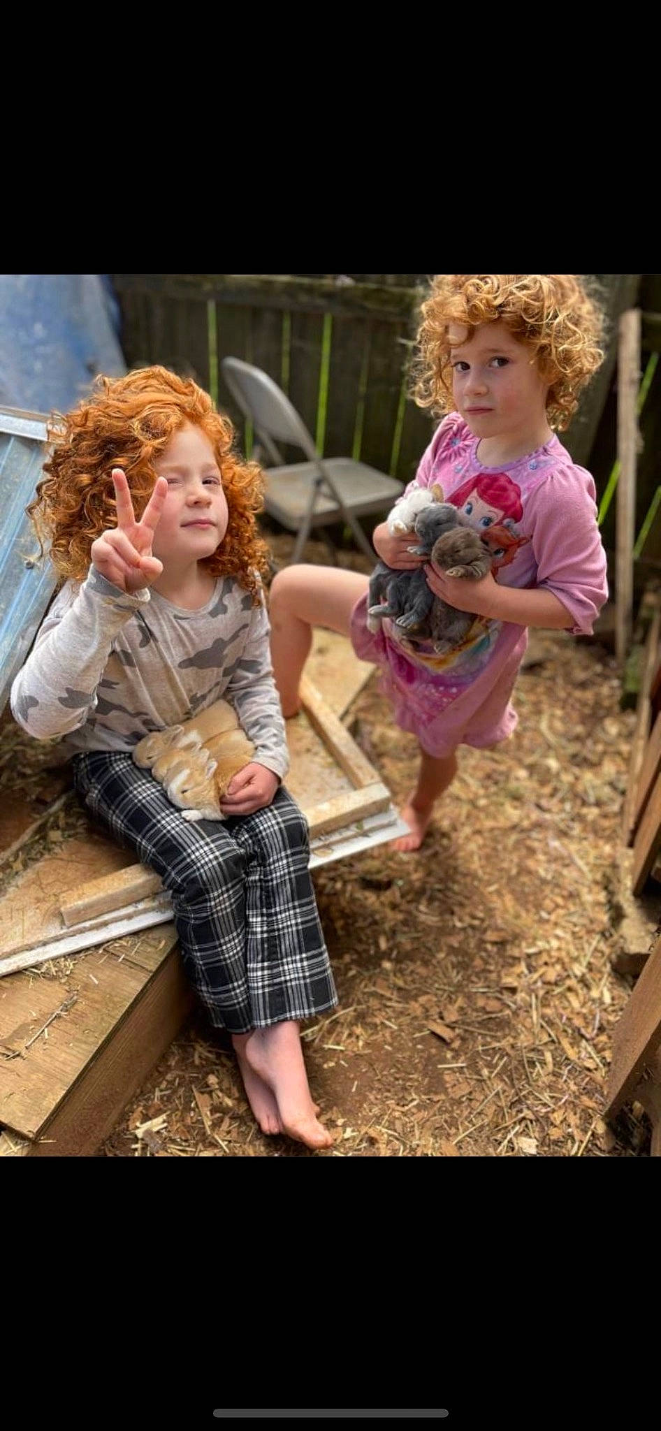 Ariel is registered to the contest to win money with this photo: adaptation, blond, brown_hair, child, face, facial_expression, fawn, fun, grass, hair, hairstyle, happy, leg, leisure, people_in_nature, person, pink, sandal, sitting, toddler