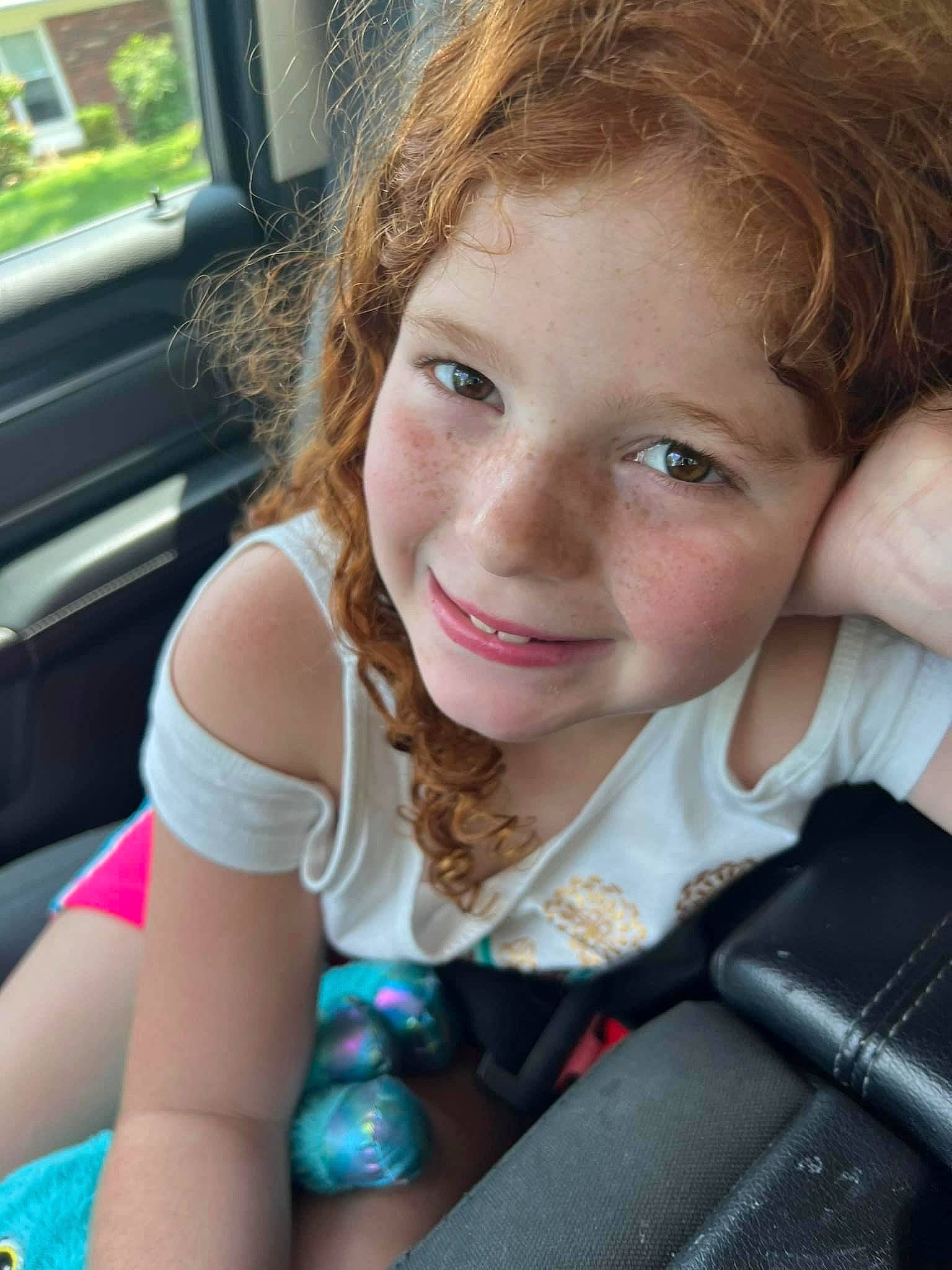 Ariel is registered to the contest to win money with this photo: blond, car_seat, child, eyebrow, facial_expression, flash_photography, fun, hair, happy, iris, joy, leisure, lip, long_hair, nose, person, plant, skin, smile, summer
