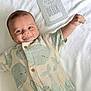baby, infant, smiling, onesie, whale_pattern, blanket, milestone_card, happy, cute, lying_down, raised_arm, buttoned_clothing, cheeky, soft_texture, two_months, blue_eyes, short_hair, indoor, portrait, child