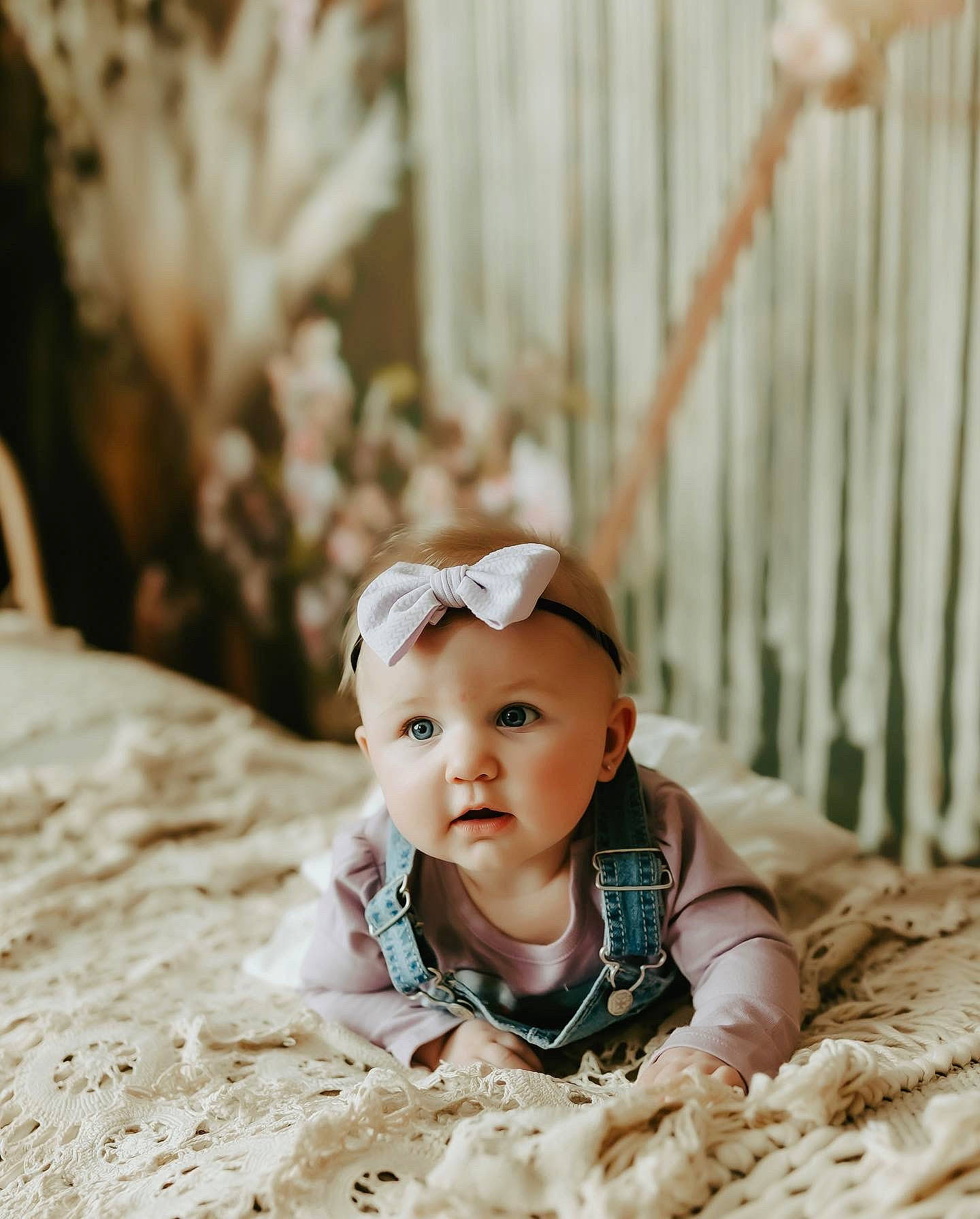 Alaia is registered to the contest to win money with this photo: baby, baby_toddler_clothing, comfort, dress, eye, flash_photography, flooring, fur, grass, happy, head, linens, people_in_nature, person, plant, sitting, skin, smile, toddler, white