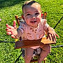 baby, child, high_chair, outdoor, grass, sunlight, happy, smiling, reaching, wood, clothing, person, cute, infant, summer, nature, portrait, baby_girl, bracelet, seat