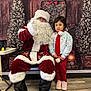 child, santa_claus, christmas, holiday, festive, red_clothing, white_beard, glasses, scarf, candy_cane, indoor, decorations, tree, smile, boots, floor, chair, table, gift_box, portrait