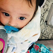 Jesse James joined the competition — help win amazing prizes! baby, blanket, child, closeup, comfort, cute, face, head, indoor, infant, pacifier, patterned_blanket, person, skin, snuggled, soft, toddler, warm, wide_eyes, young_child