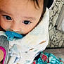 baby, blanket, child, closeup, comfort, cute, face, head, indoor, infant, pacifier, patterned_blanket, person, skin, snuggled, soft, toddler, warm, wide_eyes, young_child