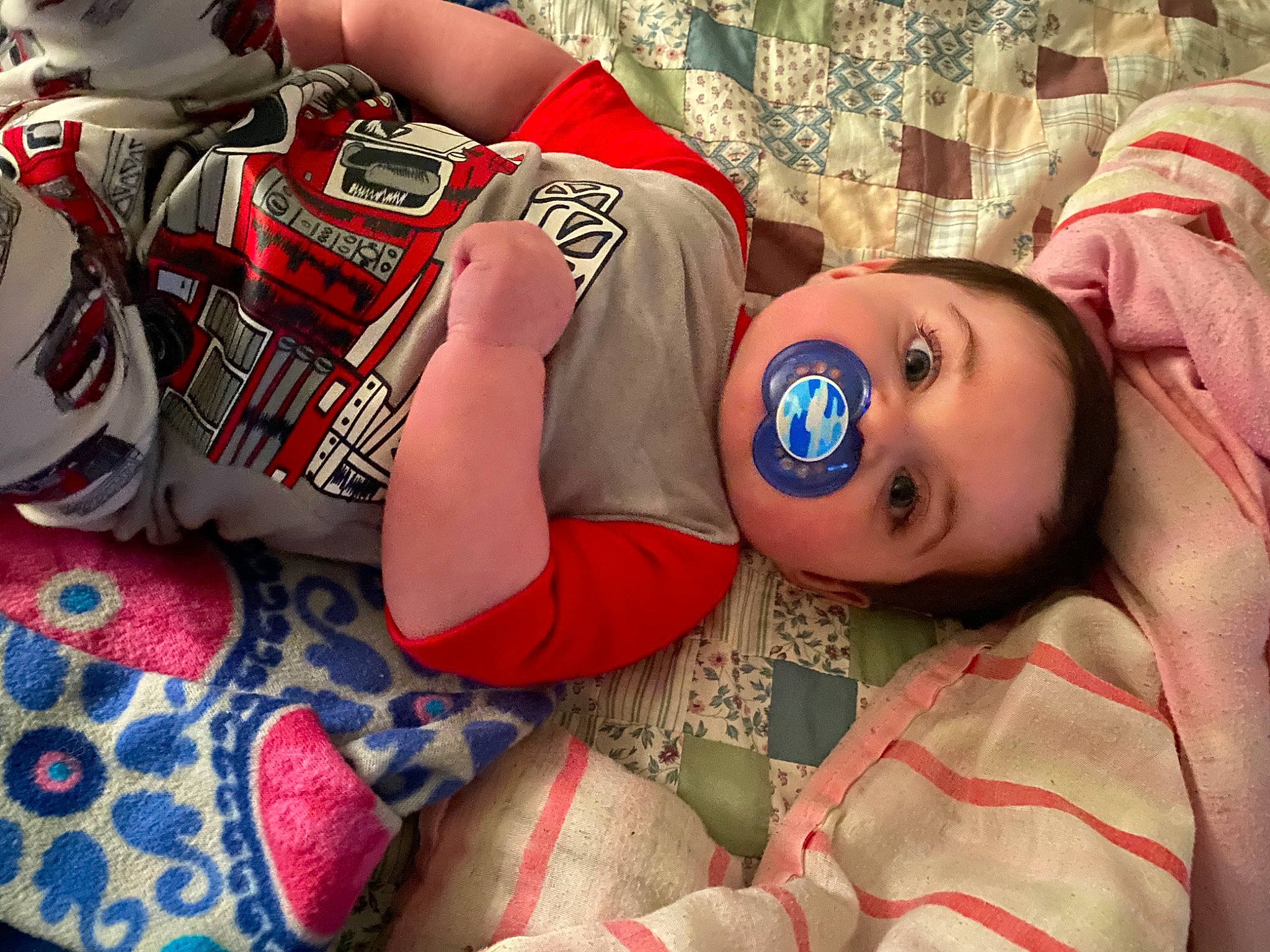 Liam is registered to the contest to win money with this photo: carmine, child, cool, costume, doll, eyewear, flooring, fun, fur, happy, human_leg, leisure, mouth, pattern, person, sports_gear, sports_uniform, sportswear, thigh, toy