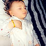 Athena a rejoint le concours — aidez-le/la à gagner de superbes lots ! toddler, sleeping, pajamas, child, bed, blanket, stripes, heart, pillow, bracelet, cute, peaceful, indoors, soft_lighting, sleepwear, baby, person, portrait, rest, calm