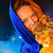 Stella a rejoint le concours — aidez-le/la à gagner de superbes lots ! woman, dog, portrait, blue_hood, velvet, snuggling, fluffy_dog, brown_dog, closeup, warmth, affection, face, pet, animal, cozy, indoor, expression, human, cuddling, blurred_background