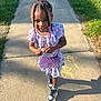 Kehlani joined the competition — help win amazing prizes! child, girl, sidewalk, sunlight, smile, braids, purple_purse, sneakers, dress, grass, outdoor, shadows, concrete, beads, happy, casual, young, person, portrait, daylight