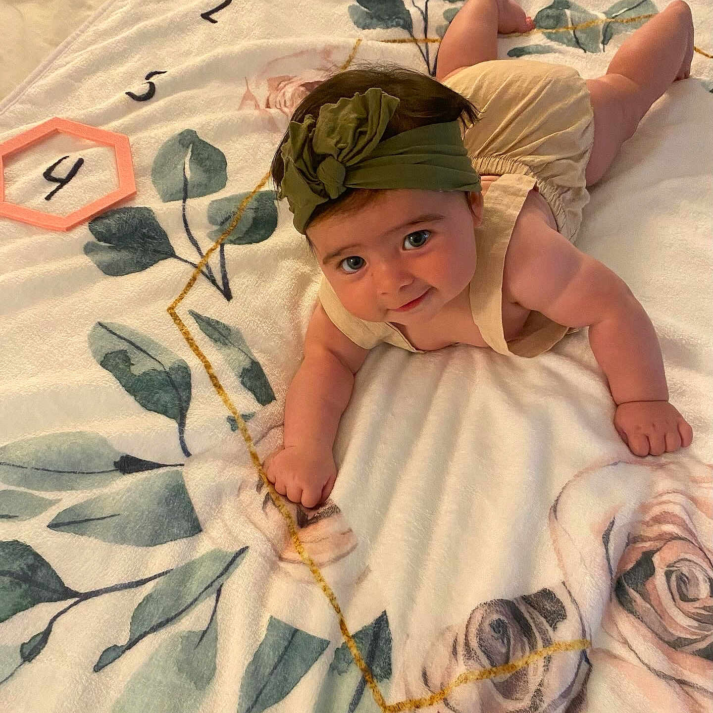 Emma is registered to the contest to win money with this photo: baby, babycrawling, blanket, clothing, crawling, person, quilt, sleeve