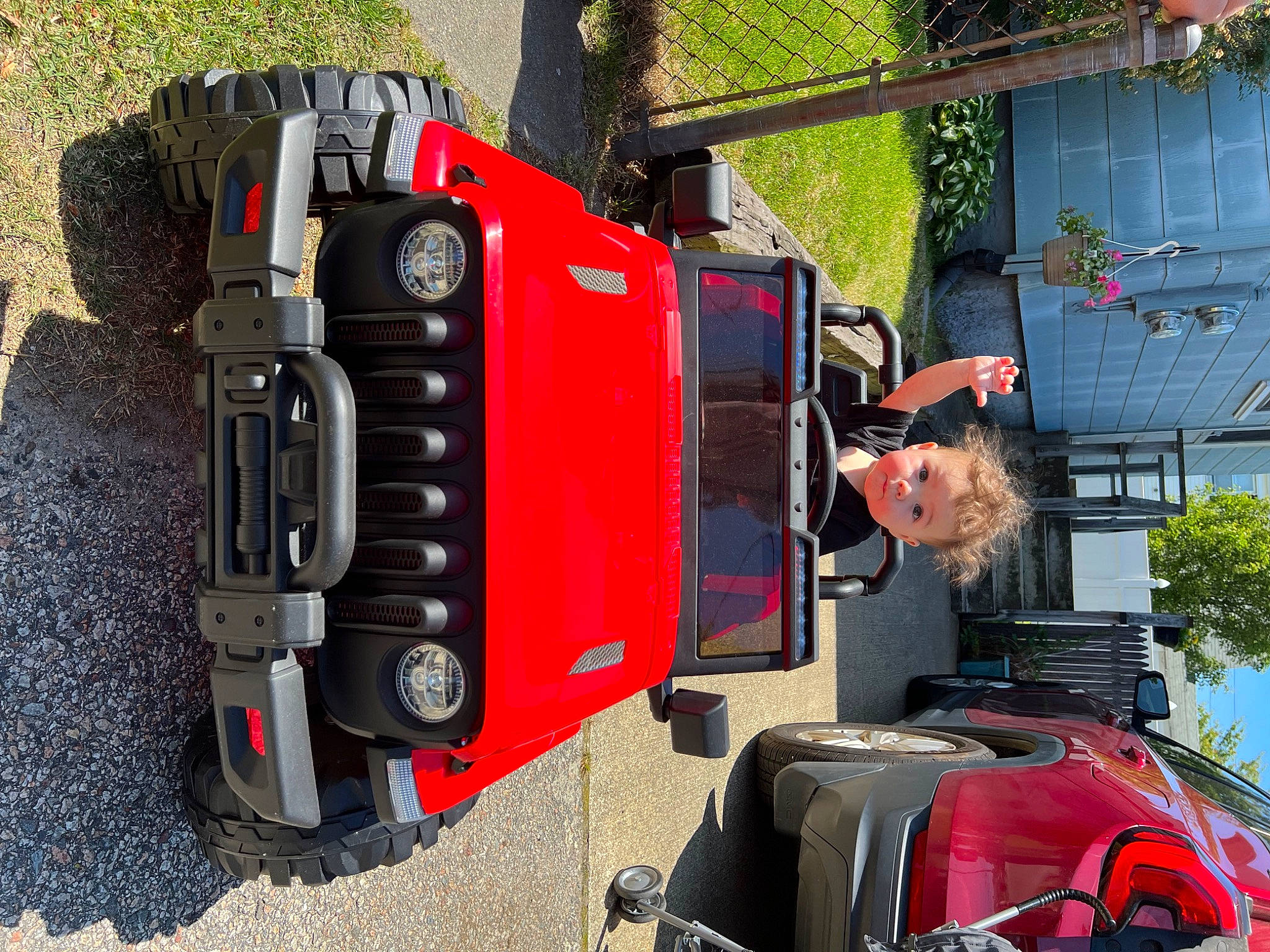 Malcolm joined the competition — help win amazing prizes! automotive_design, automotive_exterior, automotive_lighting, automotive_parking_light, automotive_tail_brake_light, automotive_tire, automotive_wheel_system, bumper, car, fender, hood, mode_of_transport, motor_vehicle, person, plant, red, rolling, tire, vehicle, wheel