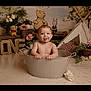 baby, child, tub, bath, tongue_out, smiling, first_birthday, one, flowers, stuffed_toy, teepee, cartoon_bear, cartoon_piglet, wooden_letters, indoor, cute, portrait, playful, decor, celebration