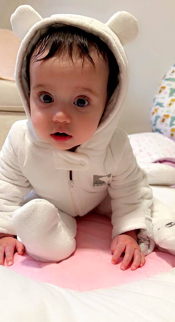 Kayla is registered to the contest to win money with this photo: baby, baby_toddler_clothing, cheek, comfort, eye, eyebrow, face, finger, floor, flooring, happy, human_body, iris, lip, mouth, nose, person, product, skin, sleeve