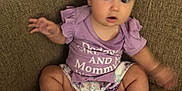Rebecca joined the competition — help win amazing prizes! baby, child, couch, cute, diaper, expression, face, furniture, hands, home, indoor, infant, legs, motion_blur, person, purple_shirt, seat, sitting, skin, text_on_clothing
