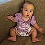 Rebecca joined the competition — help win amazing prizes! baby, child, couch, furniture, purple_shirt, diaper, indoor, expression, motion_blur, seat, person, sitting, cute, infant, home, skin, legs, face, hands, text_on_clothing