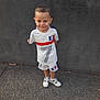 Enzo participe au concours pour gagner de l'argent avec cette photo : ball, boy, child, clothing, face, football, footwear, head, male, pants, person, photography, portrait, shoe, shorts, sneaker, soccer, soccerball, sport, t_shirt