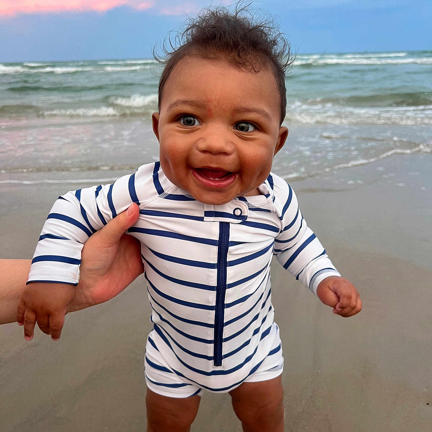Amereond joined the competition — help win amazing prizes! baby, beach, child, cute, foot, hand, happy, infant, ocean, outdoor, person, sand, sky, smiling, standing, striped_clothing, summer, sunset, water, waves