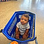 Amereond joined the competition — help win amazing prizes! baby, child, shopping_basket, blue, toy, duck, floor, indoor, curious, person, concrete, casual_clothing, infant, seated, looking_up, playful, shopping, store, wheels, boxes