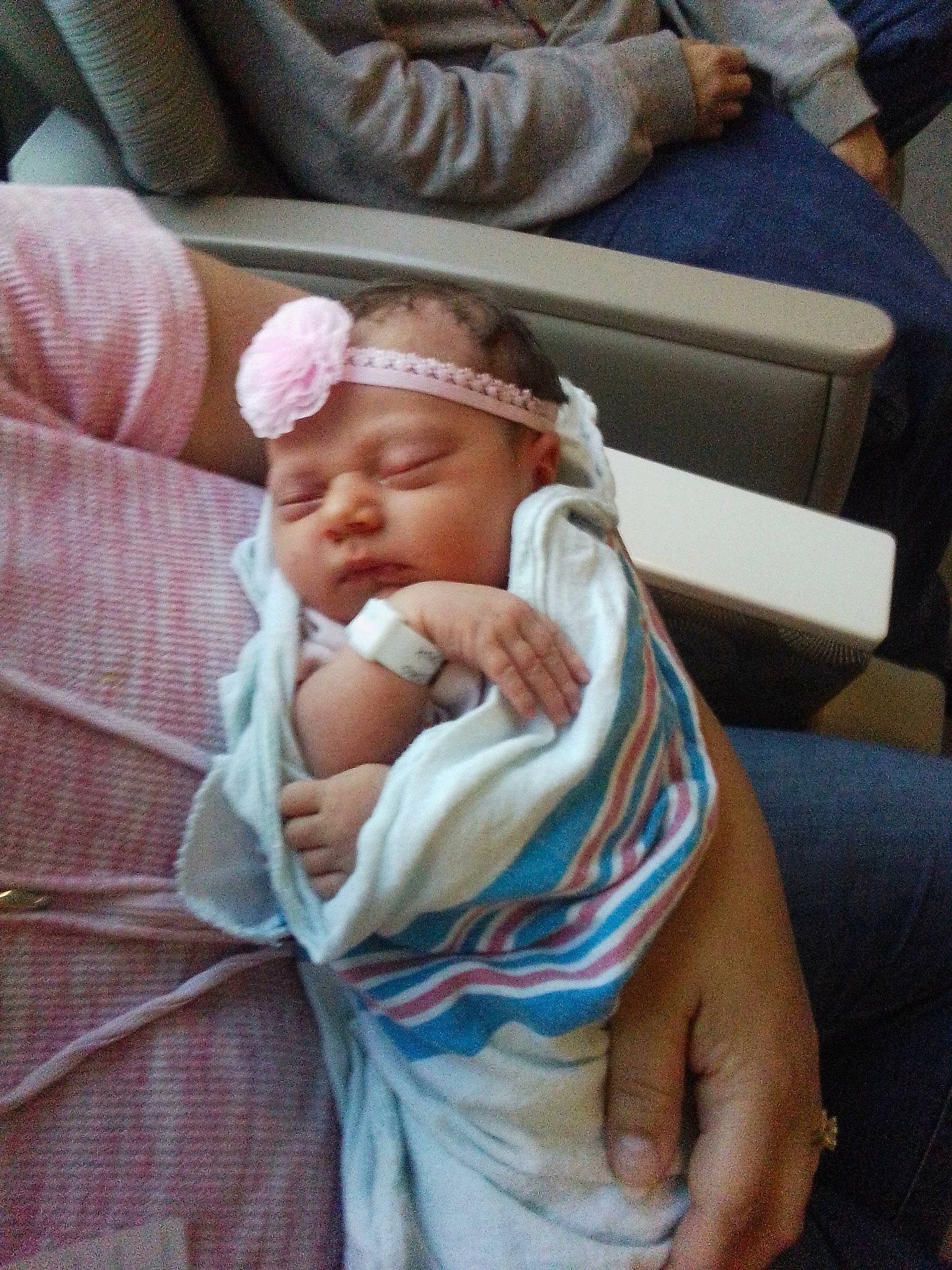 Alice is registered to the contest to win money with this photo: abdomen, baby, baby_products, baby_safety, baby_sleeping, baby_toddler_clothing, cheek, child, comfort, elbow, finger, hat, lap, linens, nap, person, room, sitting, sleep, thumb