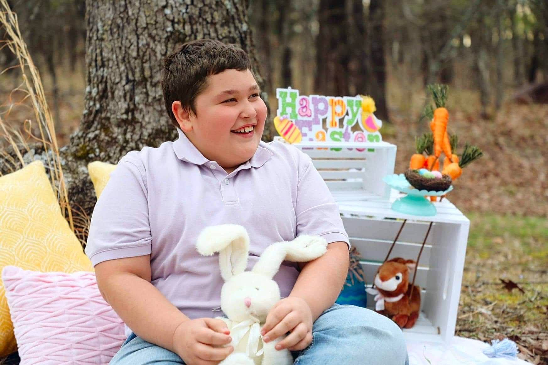 Lawrence joined the competition — help win amazing prizes! child, event, facial_expression, fun, grass, happy, jeans, joy, lap, leisure, mammal, people, people_in_nature, person, plant, recreation, sitting, smile, teddy_bear, toy