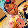 Keore joined the competition — help win amazing prizes! toddler, child, indoor, high_chair, food, eating, cartoon_tshirt, pink_clothing, glasses_filter, bear_ears_filter, heart_filter, sparkles, curly_hair, cute, playful, baby, person, floor_tiles, window, daylight