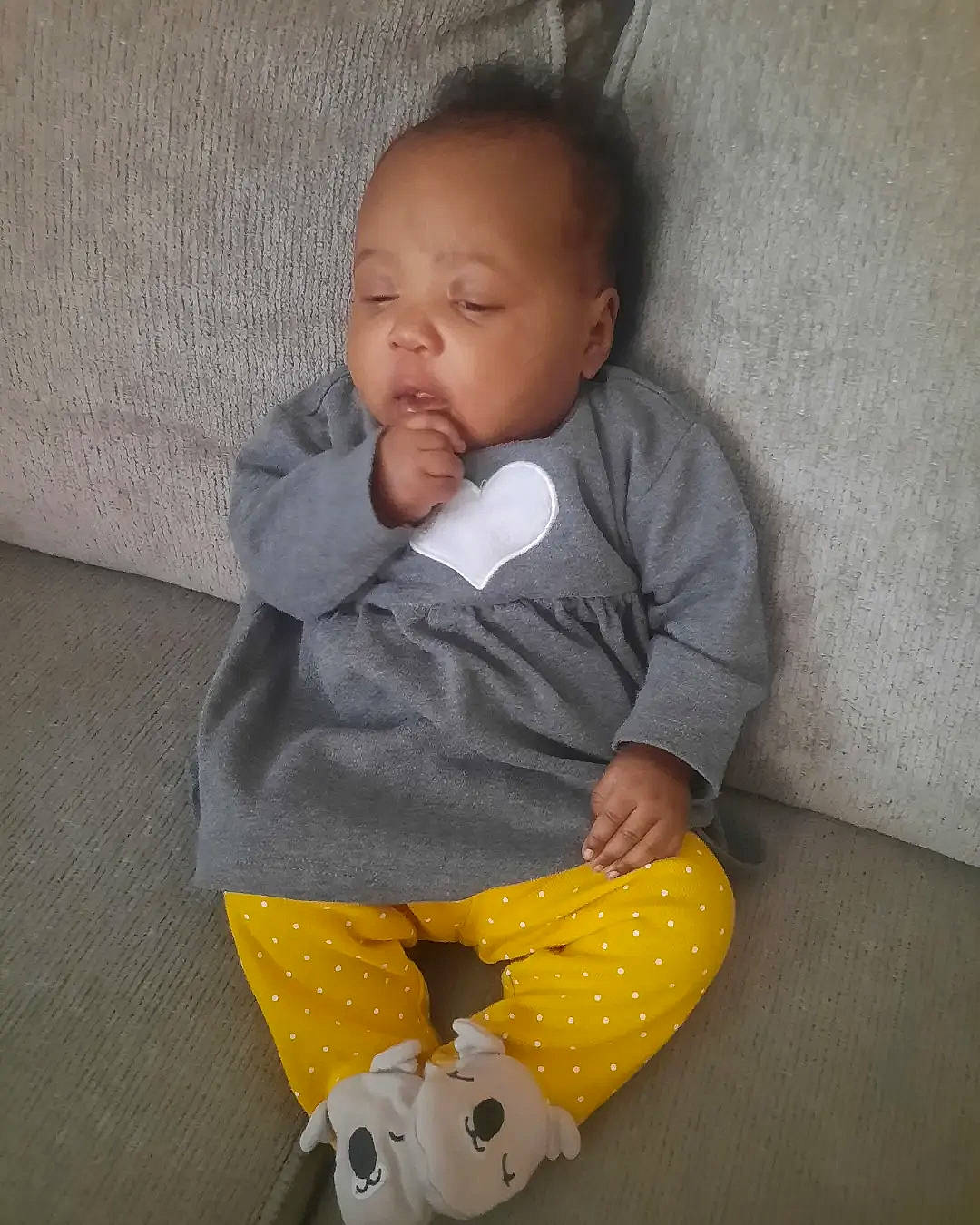 Ayana is registered to the contest to win money with this photo: baby, baby_products, baby_toddler_clothing, cheek, child, comfort, face, flooring, head, linens, nose, pattern, person, play, room, sitting, sleeve, toddler