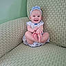 Marnie is registered to the contest to win money with this photo: baby, child, smiling, happy, headband, blue, outfit, sitting, feet, armchair, green, textured, cute, indoors, portrait, infant, person, clothing, furniture, playful