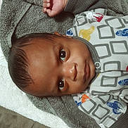 Maverick is registered to the contest to win money with this photo: applique, baby, blanket, bonnet, clothing, face, hat, head, homedecor, hoodie, knitwear, linen, newborn, pattern, person, photography, portrait, quilt, sweater, towel