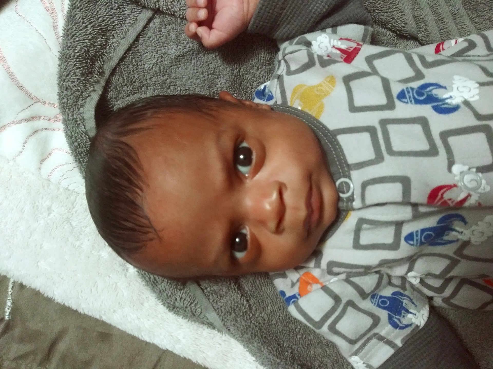 Maverick is registered to the contest to win money with this photo: applique, baby, blanket, bonnet, clothing, face, hat, head, homedecor, hoodie, knitwear, linen, newborn, pattern, person, photography, portrait, quilt, sweater, towel