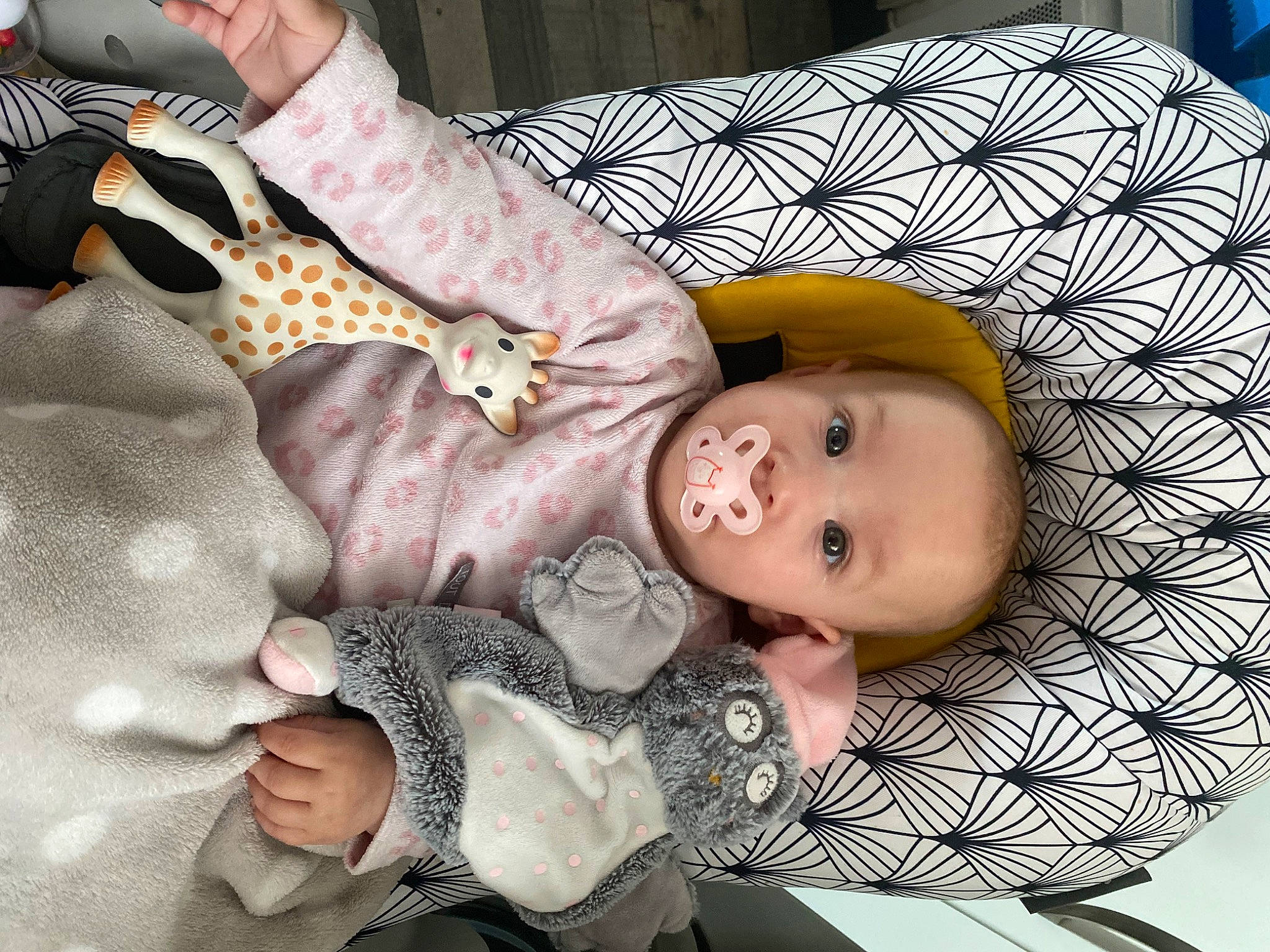 Angèle a rejoint le concours — aidez-le/la à gagner de superbes lots ! baby, baby_products, baby_sleeping, baby_toddler_clothing, cheek, child, comfort, couch, doll, fashion_accessory, happy, lap, linens, pattern, person, product, room, smile, stuffed_toy, toddler