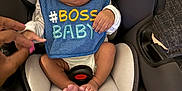 Amir is registered to the contest to win money with this photo: baby, car_seat, bib, hand, infant, blue_bib, clothing, cute, expression, face, foot, furniture, infant_seat, person, pink_nails, seat, sitting, small, skin, toddler