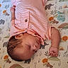baby, sleeping, infant, portrait, striped_outfit, pink_clothing, play_mat, safari_pattern, animal_pattern, giraffe, elephant, crocodile, sock, fist, indoors, lying_down, peaceful, cute, close_up, child
