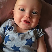 Alexander joined the competition — help win amazing prizes! baby, child, smiling, onesie, star_pattern, infant, cute, face, eyes, soft, cushion, pink, clothing, portrait, indoors, happy, skin, head, person, young