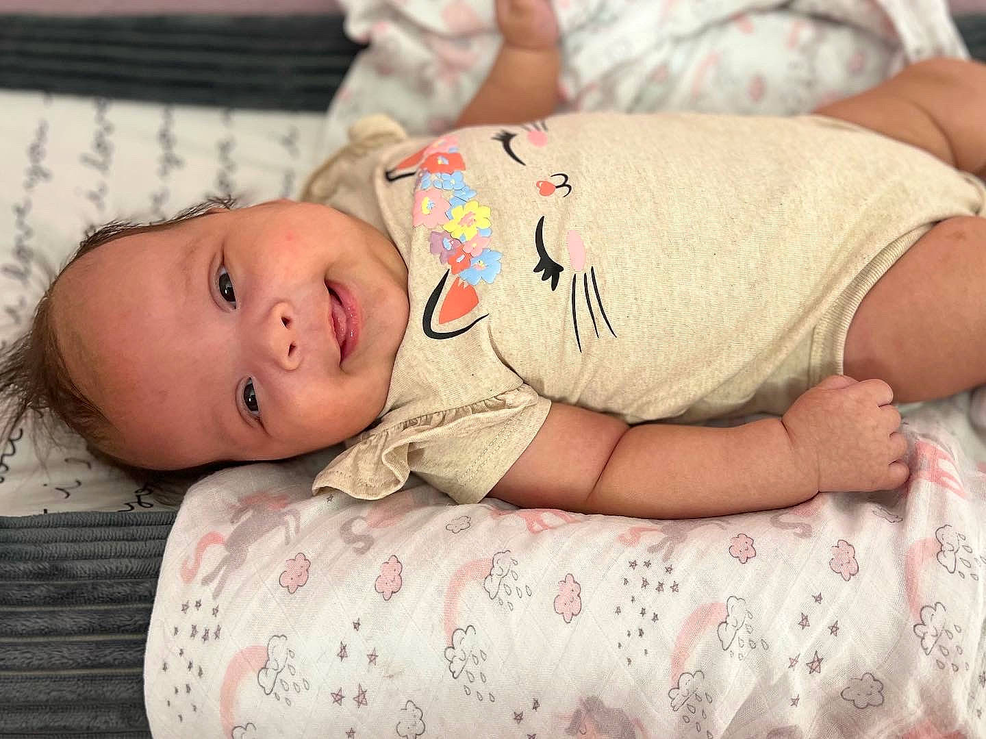 Malia joined the competition — help win amazing prizes! baby, baby_products, baby_toddler_clothing, bedtime, cheek, child, chin, comfort, elbow, eye, headgear, linens, pattern, person, room, sitting, skin, sleeve, stomach, toddler